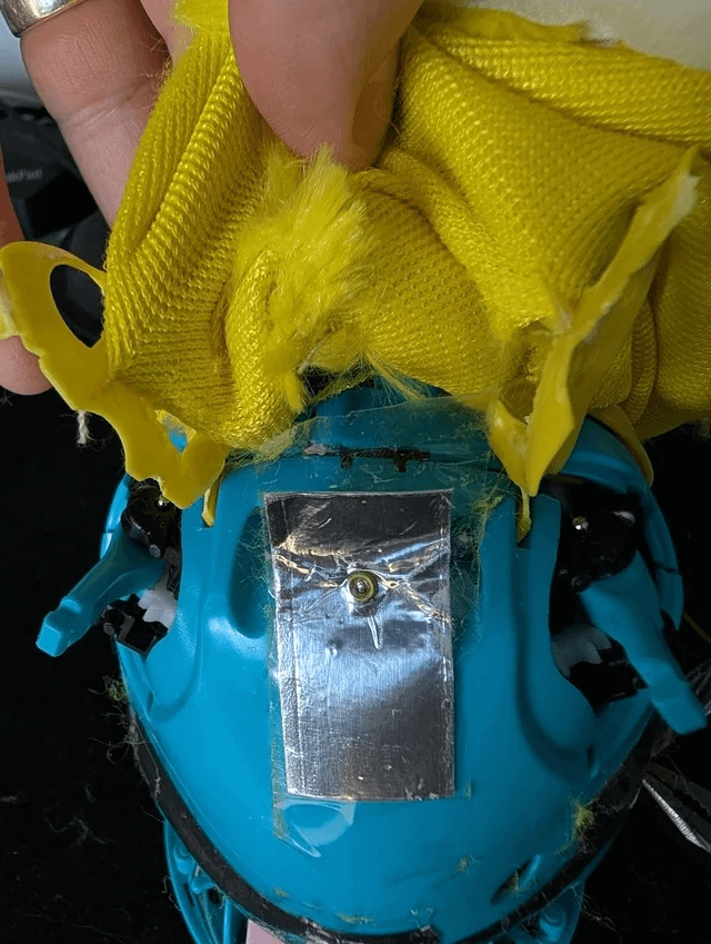 Foil touch sensor tape on top of the Furby shell