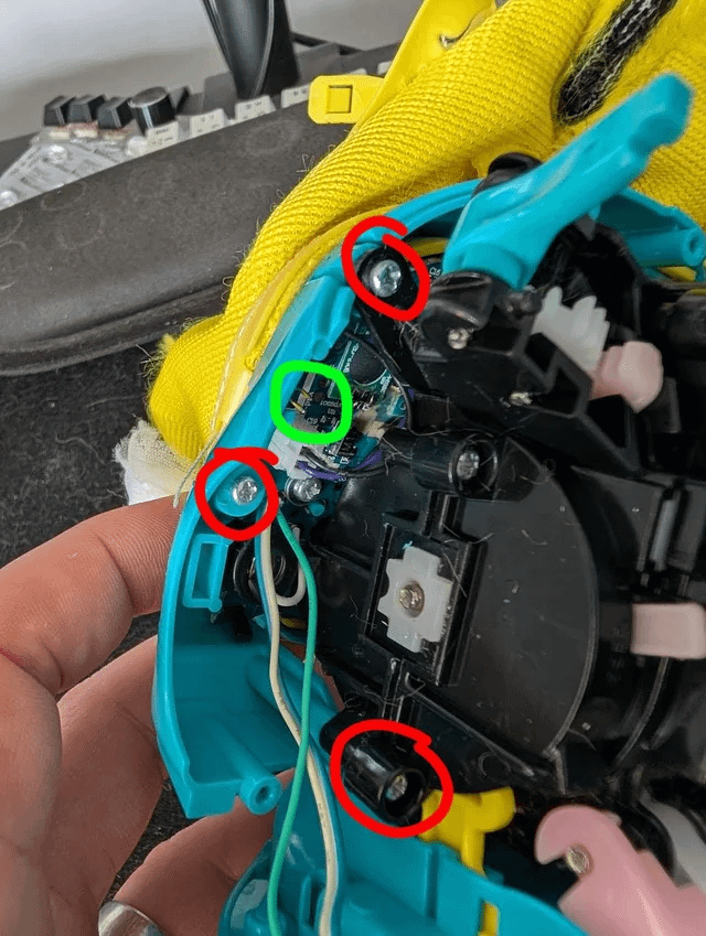 Speaker side Furby screws and speaker plug marked