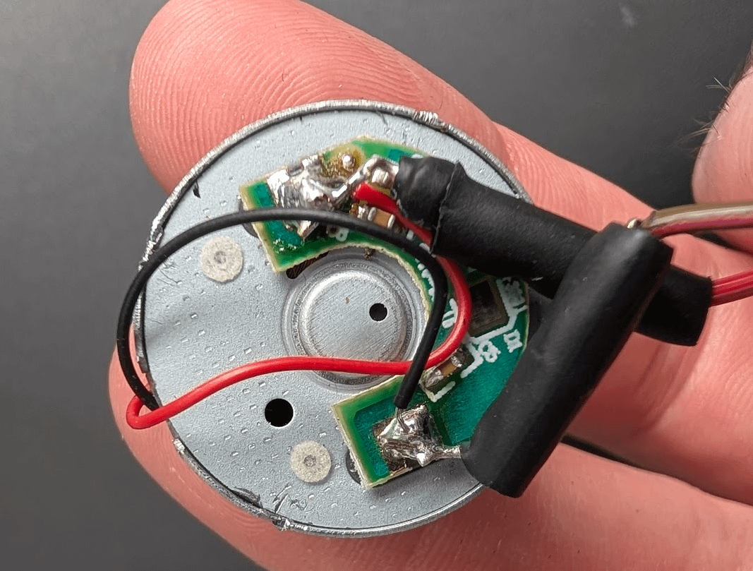 Repaired motor board showing red and black wire positions