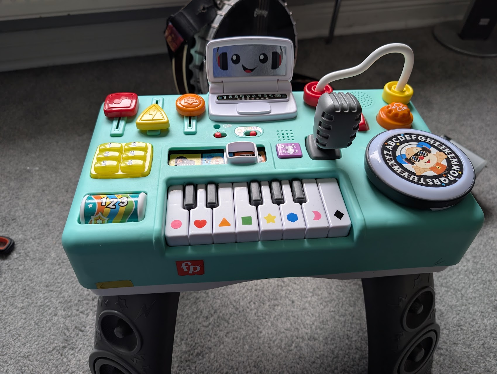 The rebuilt turquoise Fisher-Price DJ Table with its keyboard, microphone and platter